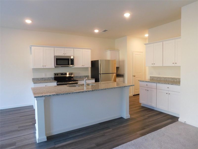 Furnished interior view inside a new home in Royal Pines, Porter (Image 7).