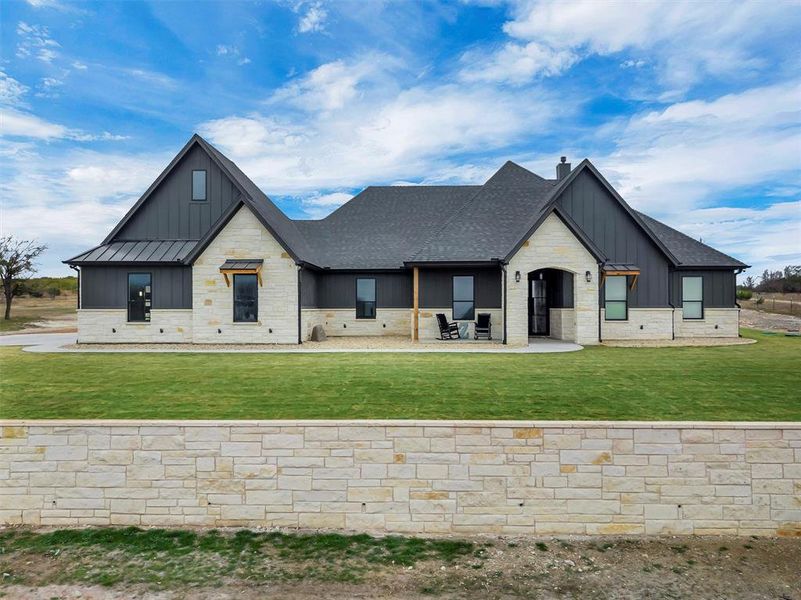 Front exterior of a new home in , Godley, TX, highlighting curb appeal (Image 2). Front exterior of a new home in , Godley, TX, highlighting curb appeal (Image 2).