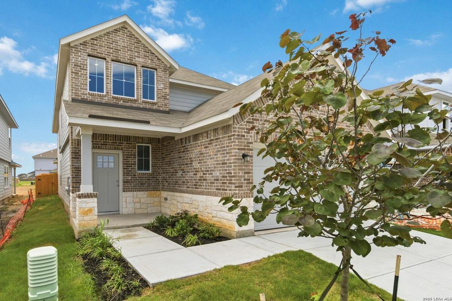 Front exterior of a new home in Red Hawk Landing, San Antonio, TX, highlighting curb appeal (Image 1). Front exterior of a new home in Red Hawk Landing, San Antonio, TX, highlighting curb appeal (Image 1).