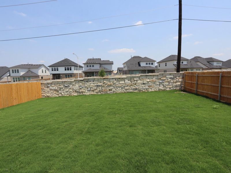 Front exterior of a new home in Cascades at Onion Creek, Austin, TX, highlighting curb appeal (Image 14). Front exterior of a new home in Cascades at Onion Creek, Austin, TX, highlighting curb appeal (Image 14).