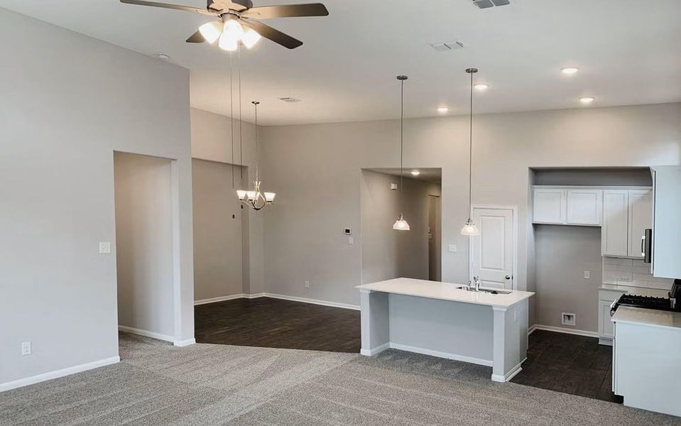 Seamless dining and living space filled with natural light, soaring ceilings, and modern finishes, creating a welcoming atmosphere ideal for family gatherings and memorable celebrations. **Photos are representative only and may vary as built.** Seamless dining and living space filled with natural light, soaring ceilings, and modern finishes, creating a welcoming atmosphere ideal for family gatherings and memorable celebrations. **Photos are representative only and may vary as built.**