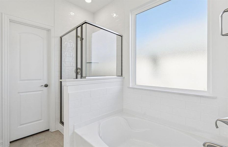 Owner's bath designed with a large tub and shower Owner's bath designed with a large tub and shower