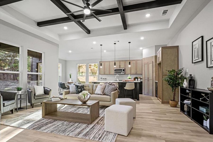 Living room with beam ceiling, ceiling fan, sink, coffered ceiling, and light wood-type flooring