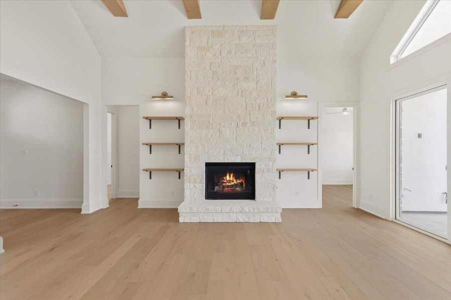 A striking stone fireplace, vaulted ceilings and open beams are the focal points in the main living space. A striking stone fireplace, vaulted ceilings and open beams are the focal points in the main living space.