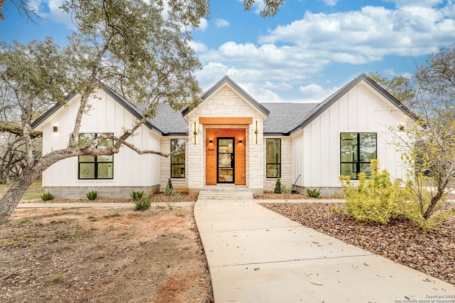 Front exterior of a new home in , Floresville, TX, highlighting curb appeal (Image 2).