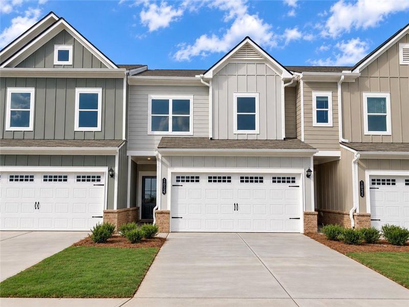 Front exterior of a new home in Townes At The Stiles, Cartersville, GA, highlighting curb appeal (Image 1). Front exterior of a new home in Townes At The Stiles, Cartersville, GA, highlighting curb appeal (Image 1).