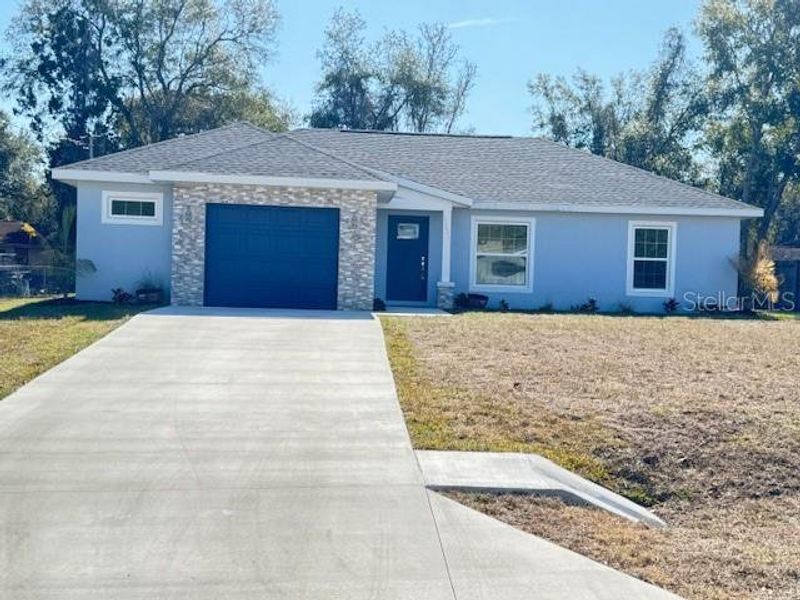 Front exterior of a new home in , Ocklawaha, FL, highlighting curb appeal (Image 18).