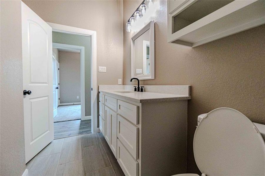 Bathroom featuring vanity and toilet