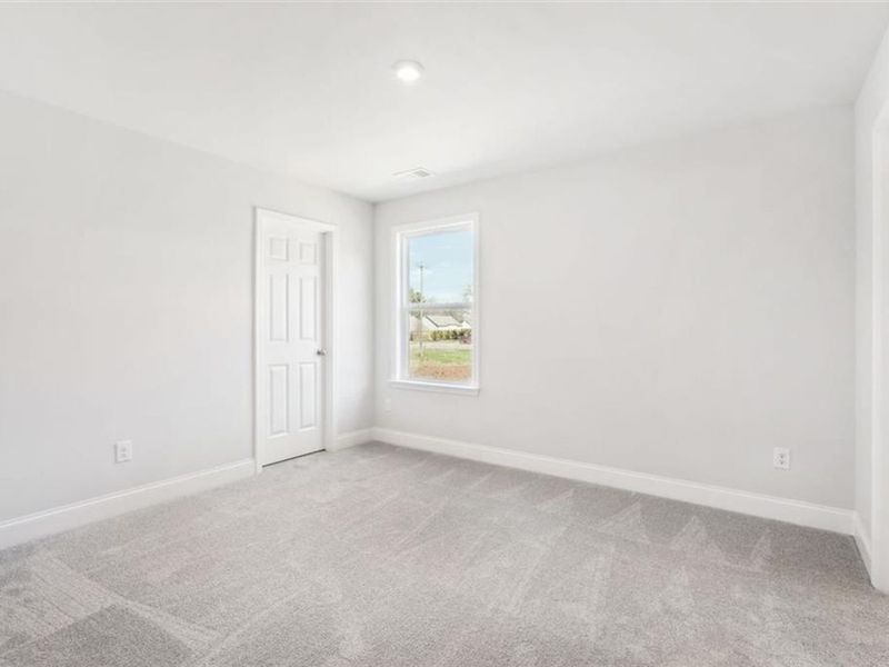 Spacious, unfurnished interior of a new home in Wehunt Meadows, Hoschton (Image 60).