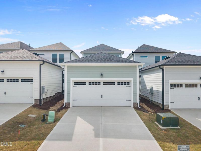 Front exterior of a new home in Forestville Yard, Knightdale, NC, highlighting curb appeal (Image 20).