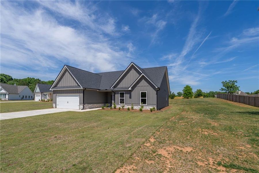 Front exterior of a new home in , Good Hope, GA, highlighting curb appeal (Image 20). Front exterior of a new home in , Good Hope, GA, highlighting curb appeal (Image 20).