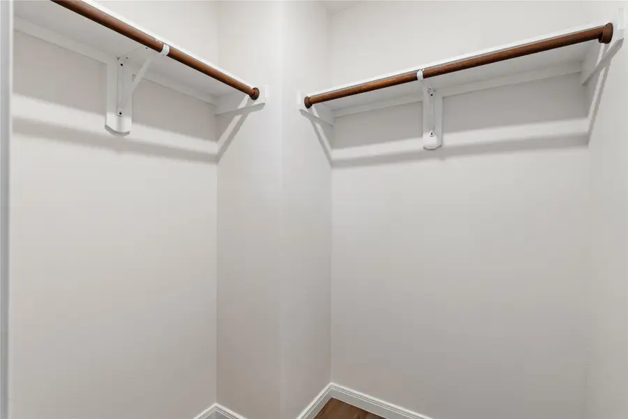A well-sized walk-in closet in the primary suite, designed for everyday functionality.