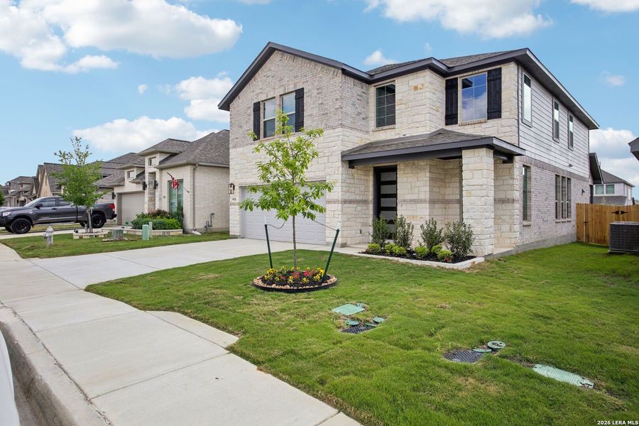 Front exterior of a new home in Kallison Ranch, San Antonio, TX, highlighting curb appeal (Image 24). Front exterior of a new home in Kallison Ranch, San Antonio, TX, highlighting curb appeal (Image 24).
