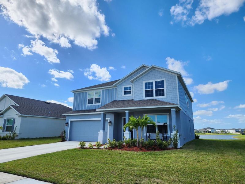 Front exterior of a new home in , Port St. Lucie, FL, highlighting curb appeal (Image 30). Front exterior of a new home in , Port St. Lucie, FL, highlighting curb appeal (Image 30).