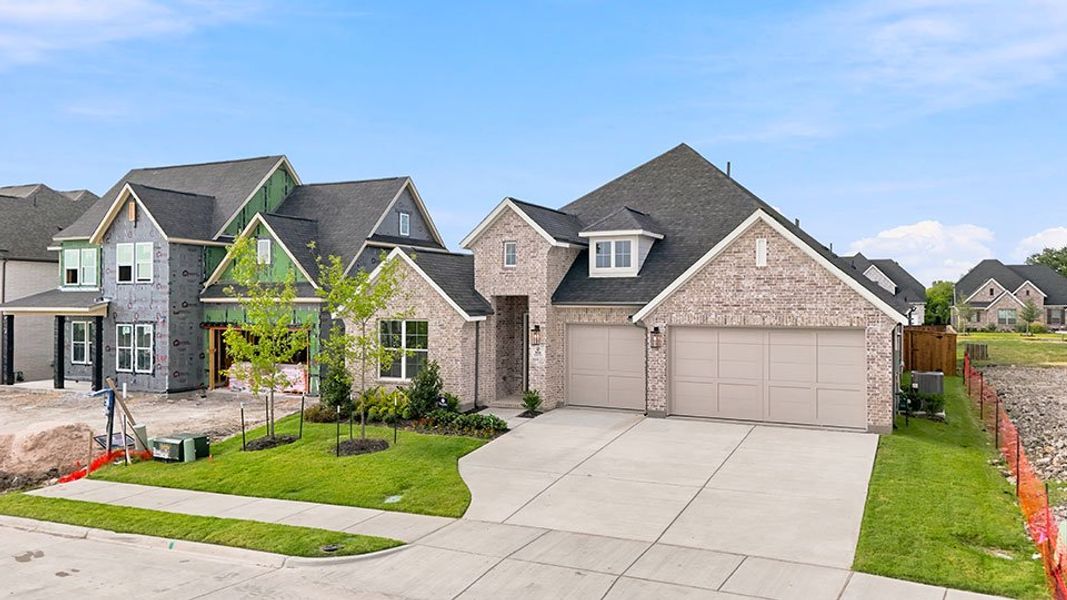 Front exterior of a new home in The Homestead - 62', Rockwall, TX, highlighting curb appeal (Image 23). Front exterior of a new home in The Homestead - 62', Rockwall, TX, highlighting curb appeal (Image 23).
