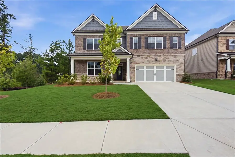 Front exterior of a new home in , Lawrenceville, GA, highlighting curb appeal (Image 1). Front exterior of a new home in , Lawrenceville, GA, highlighting curb appeal (Image 1).