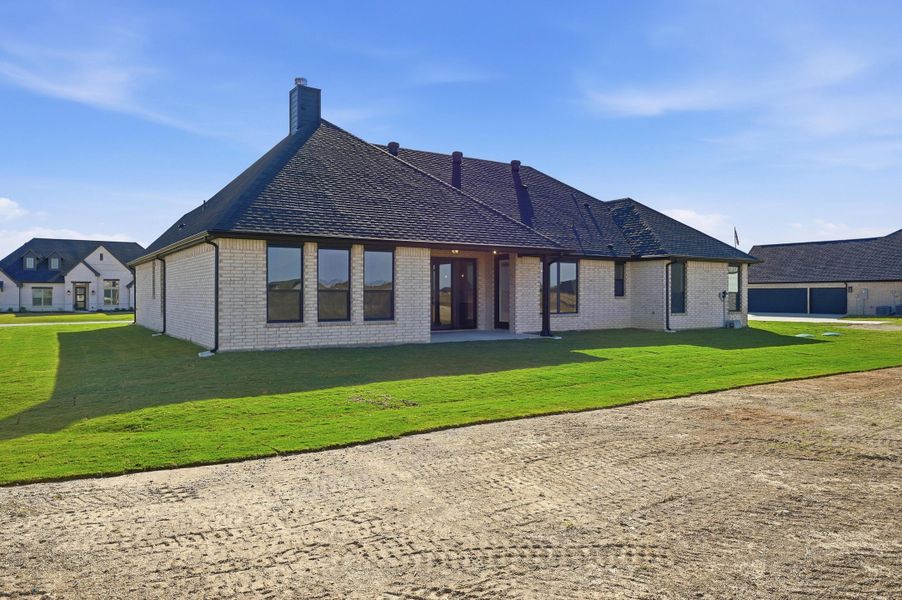 Front exterior of a new home in Rocky Top Ranch, Azle, TX, highlighting curb appeal (Image 24). Front exterior of a new home in Rocky Top Ranch, Azle, TX, highlighting curb appeal (Image 24).