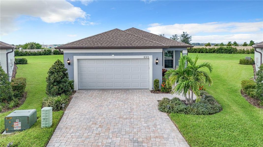 Front exterior of a new home in Del Webb BayView, Parrish, FL, highlighting curb appeal (Image 19).