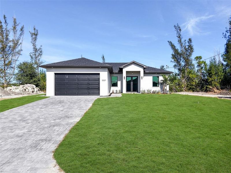 Front exterior of a new home in , Cape Coral, FL, highlighting curb appeal (Image 23).