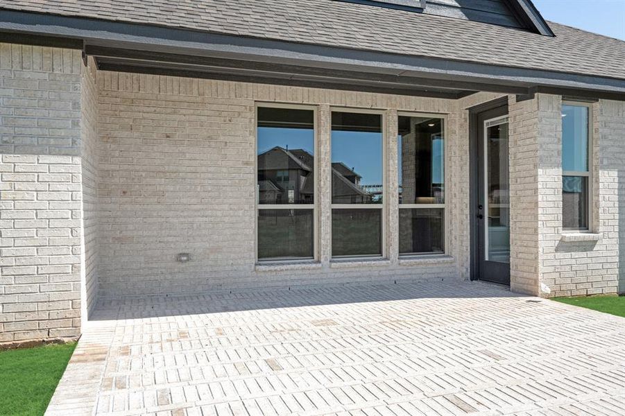 Exterior details and patio area of a home in Abe's Landing, Granbury (Image 4).