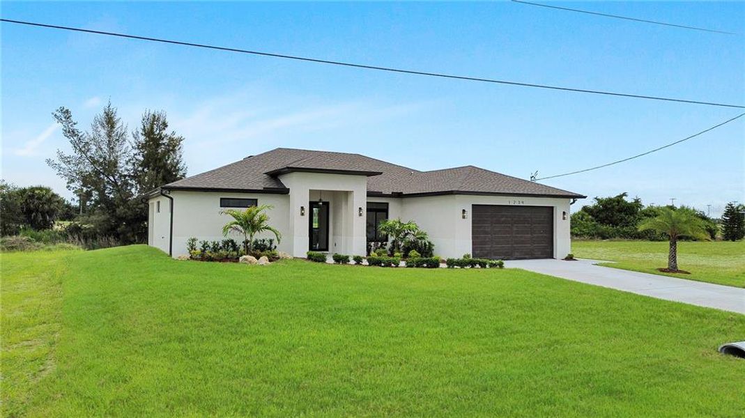 Front exterior of a new home in , Cape Coral, FL, highlighting curb appeal (Image 30).