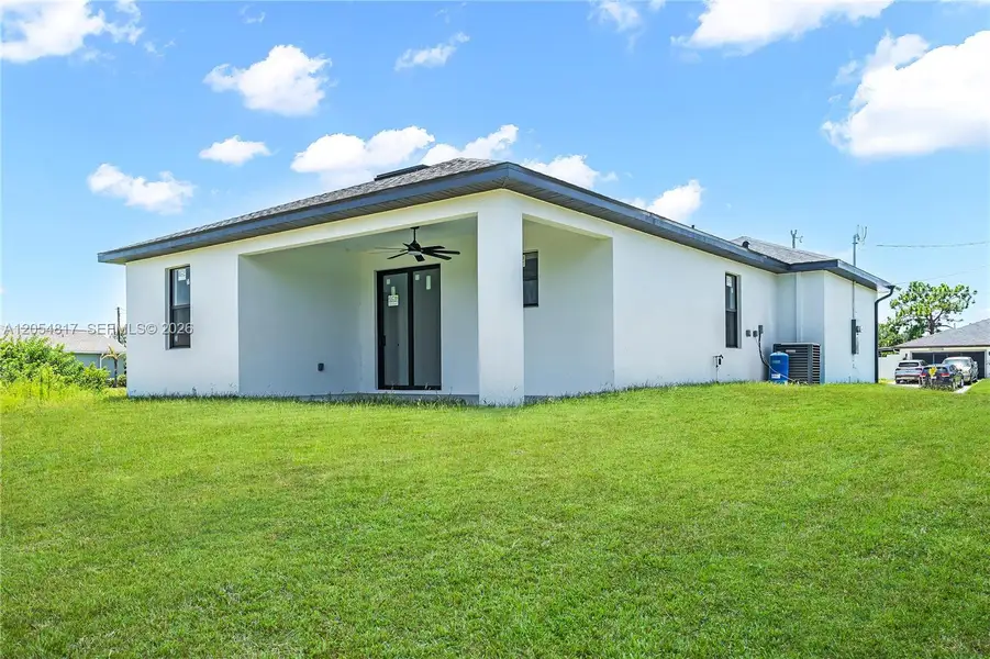 Exterior details and patio area of a home in , Lehigh Acres (Image 4). Exterior details and patio area of a home in , Lehigh Acres (Image 4).