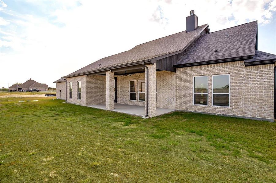 Front exterior of a new home in Rocky Top Ranch, Reno, TX, highlighting curb appeal (Image 23). Front exterior of a new home in Rocky Top Ranch, Reno, TX, highlighting curb appeal (Image 23).
