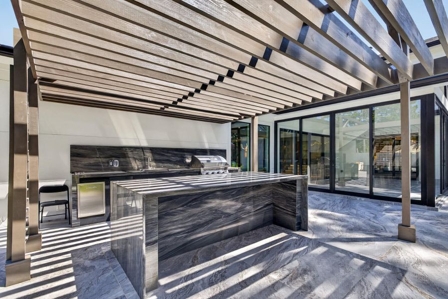 Exceptional covered outdoor entertaining area designed for year-round enjoyment.