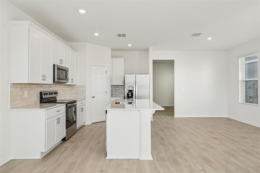 Furnished interior view inside a new home in The Meadow at Crossprairie Bungalows, St. Cloud (Image 9).
