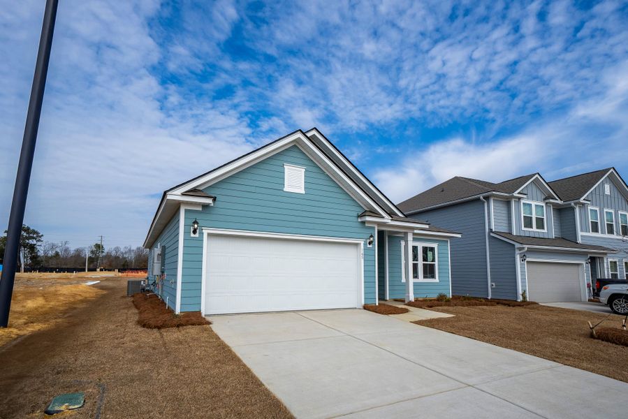 Front exterior of a new home in Monroe Preserve, Chapin, SC, highlighting curb appeal (Image 26).