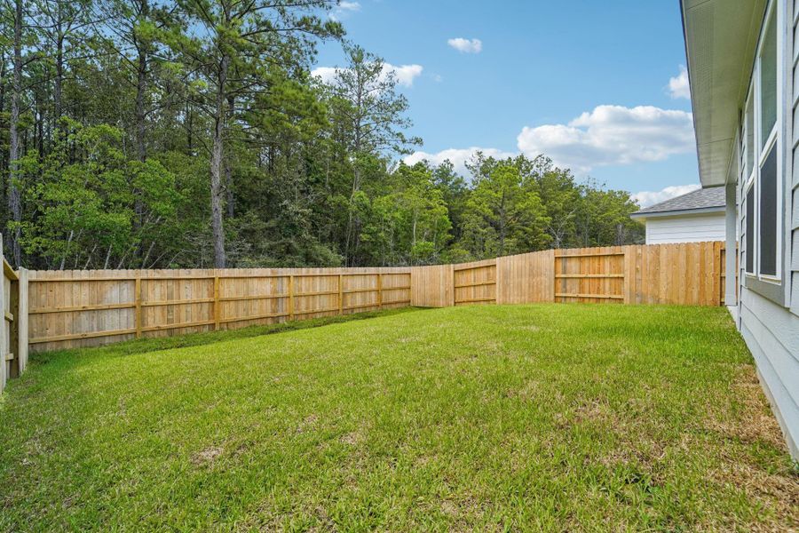 Front exterior of a new home in Landing Meadows - Traditional Series, New Caney, TX, highlighting curb appeal (Image 25). Front exterior of a new home in Landing Meadows - Traditional Series, New Caney, TX, highlighting curb appeal (Image 25).