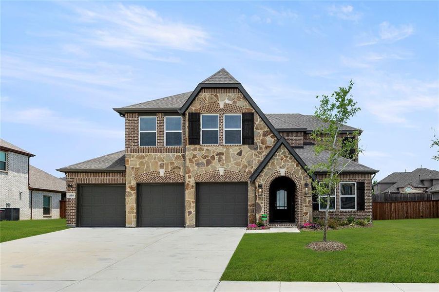 Front exterior of a new home in Grayhawk Addition, Forney, TX, highlighting curb appeal (Image 1).