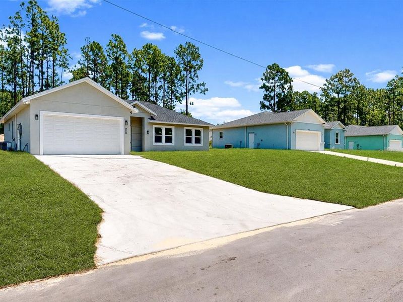 Front exterior of a new home in , Ocala, FL, highlighting curb appeal (Image 1). Front exterior of a new home in , Ocala, FL, highlighting curb appeal (Image 1).