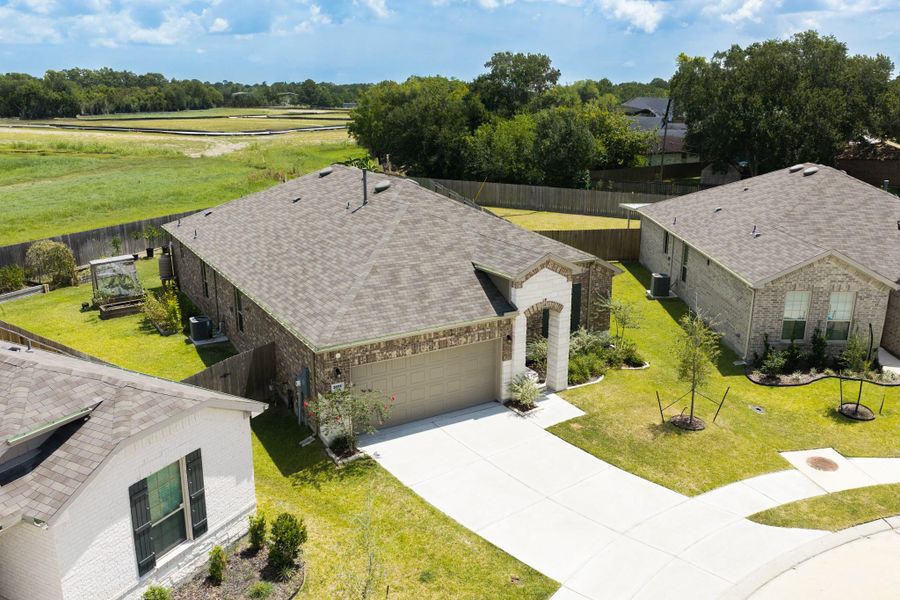 Front exterior of a new home in Mustang Ridge, Alvin, TX, highlighting curb appeal (Image 23).