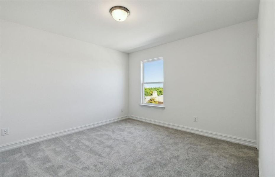 Spacious secondary bedroom with ample closet space *real home pictured