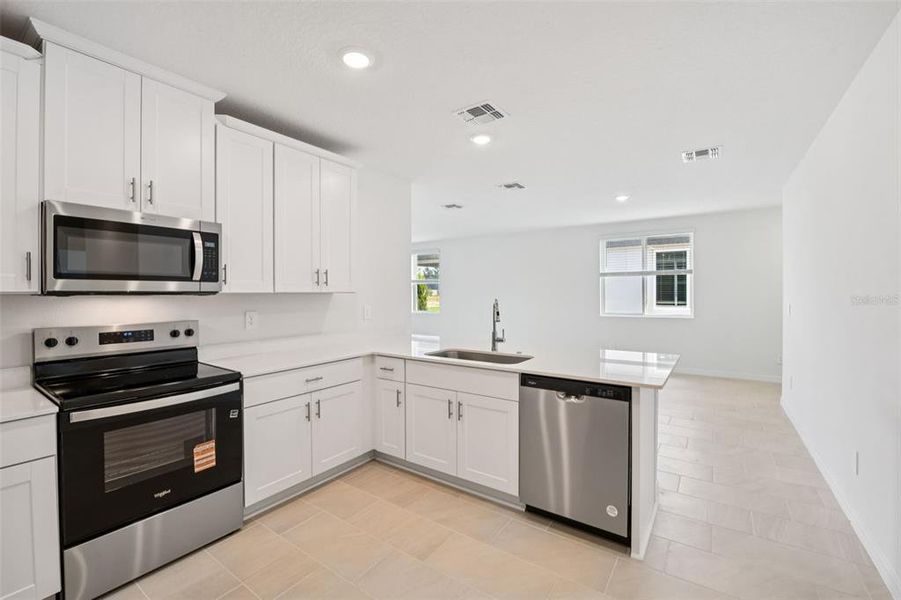 Furnished interior view inside a new home in Ridgehaven - Villas, Ormond Beach (Image 11).