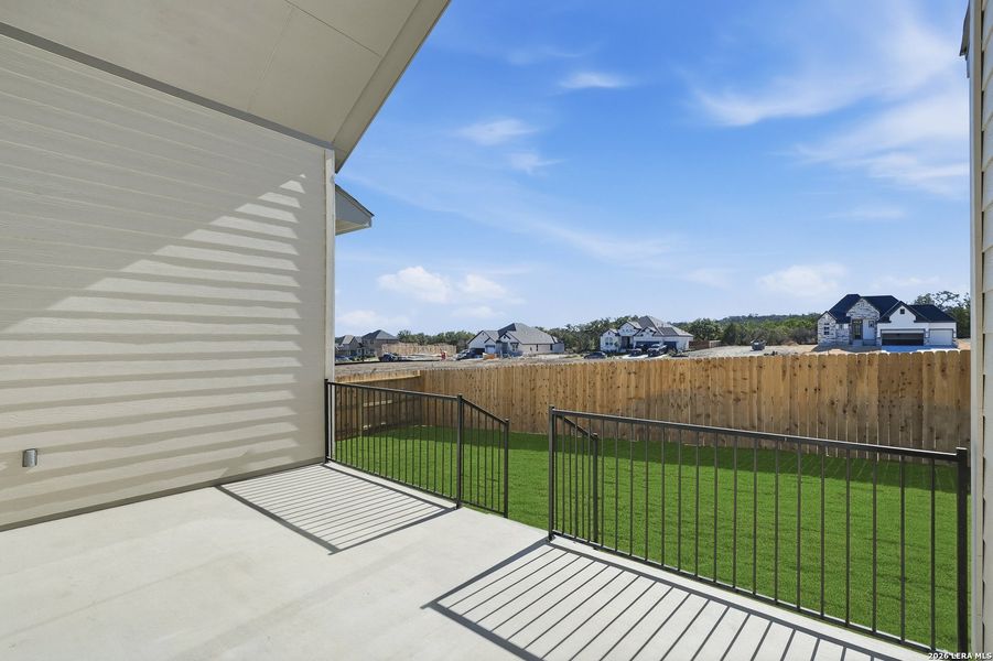 Exterior details and patio area of a home in Potranco Oaks, Castroville (Image 28).