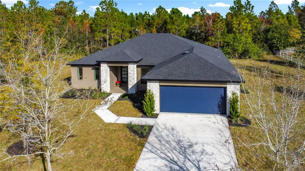 Front exterior of a new home in , Orlando, FL, highlighting curb appeal (Image 2). Front exterior of a new home in , Orlando, FL, highlighting curb appeal (Image 2).