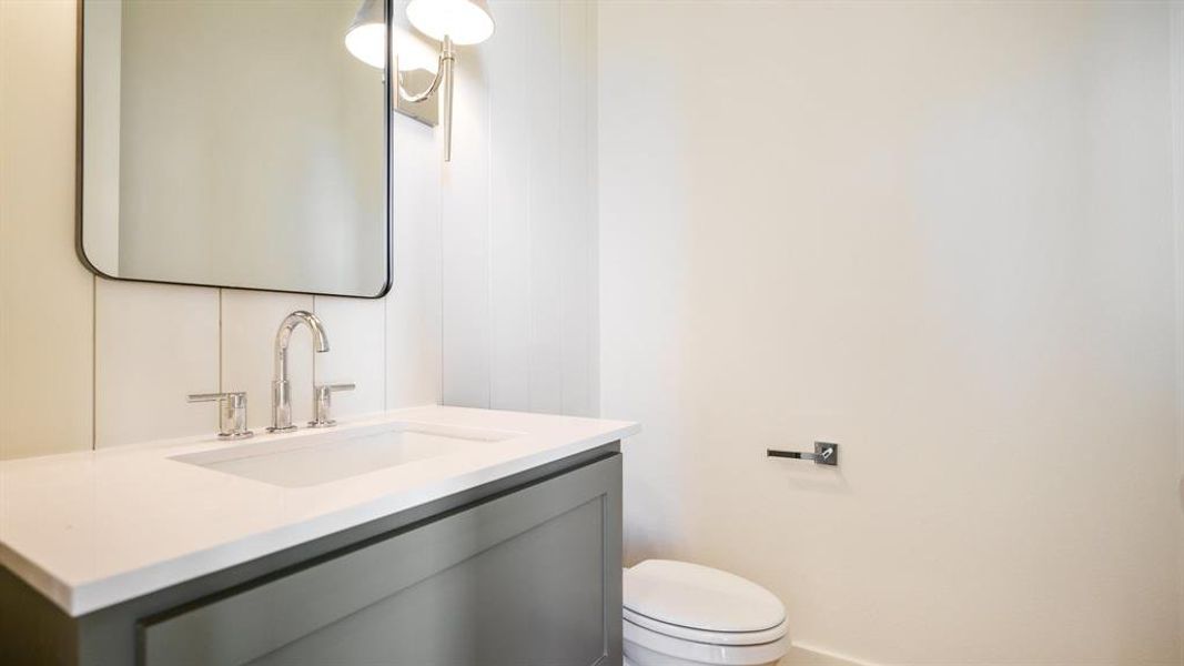 Bathroom with toilet and vanity