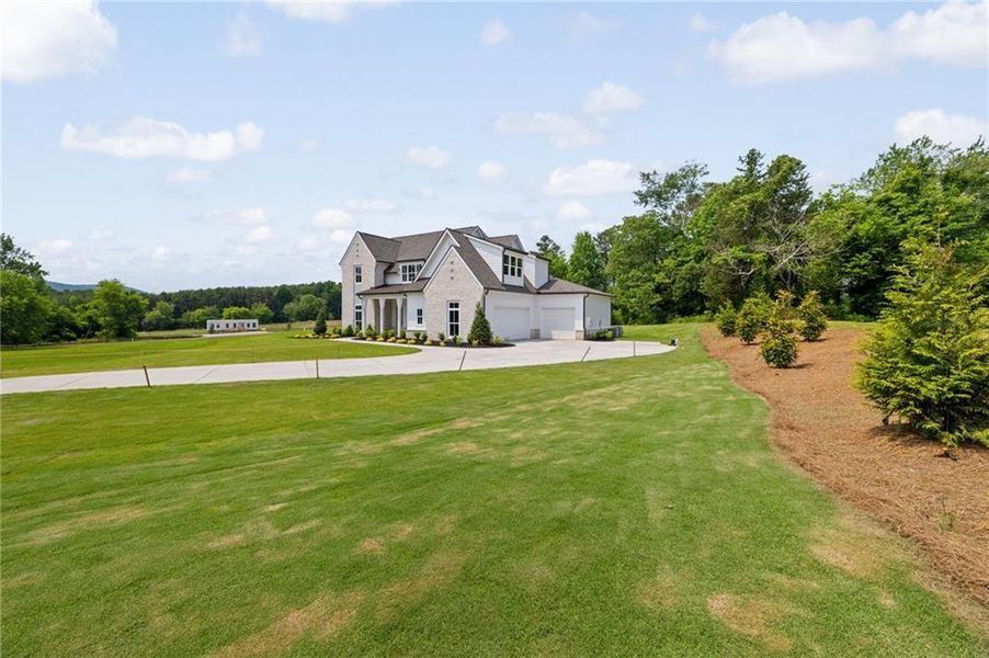 Front exterior of a new home in , Rydal, GA, highlighting curb appeal (Image 24). Front exterior of a new home in , Rydal, GA, highlighting curb appeal (Image 24).