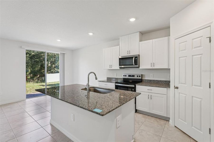 Furnished interior view inside a new home in Bradbury Creek - Signature Series, Haines City (Image 12).