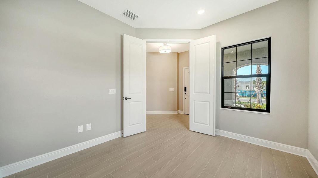 Spacious, unfurnished interior of a new home in Vicenza Real Estate and Homes for Sale in North Venice, FL - Neal Communities, Venice (Image 25).