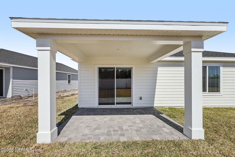 Exterior details and patio area of a home in Colbert Landings, Palm Coast (Image 4).