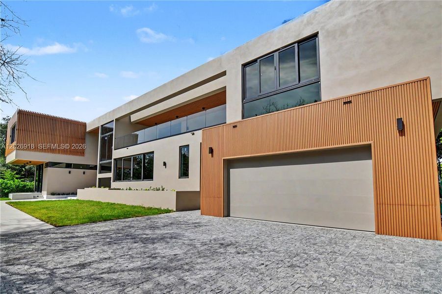 Front exterior of a new home in , Pinecrest, FL, highlighting curb appeal (Image 14).