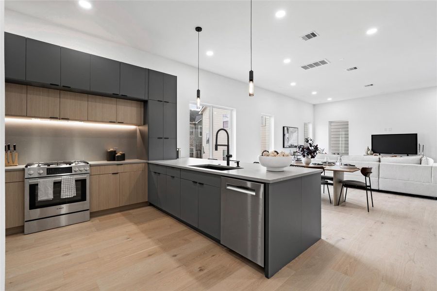 With uninterrupted flow from the island to the dining and living areas, the second floor is designed for connection.Whether entertaining or enjoying a quiet evening in, this open-concept layout brings effortless hospitality to the forefront—anchored by warm finishes, clean lines, and layered lighting that adapts as easily as the moments it holds.