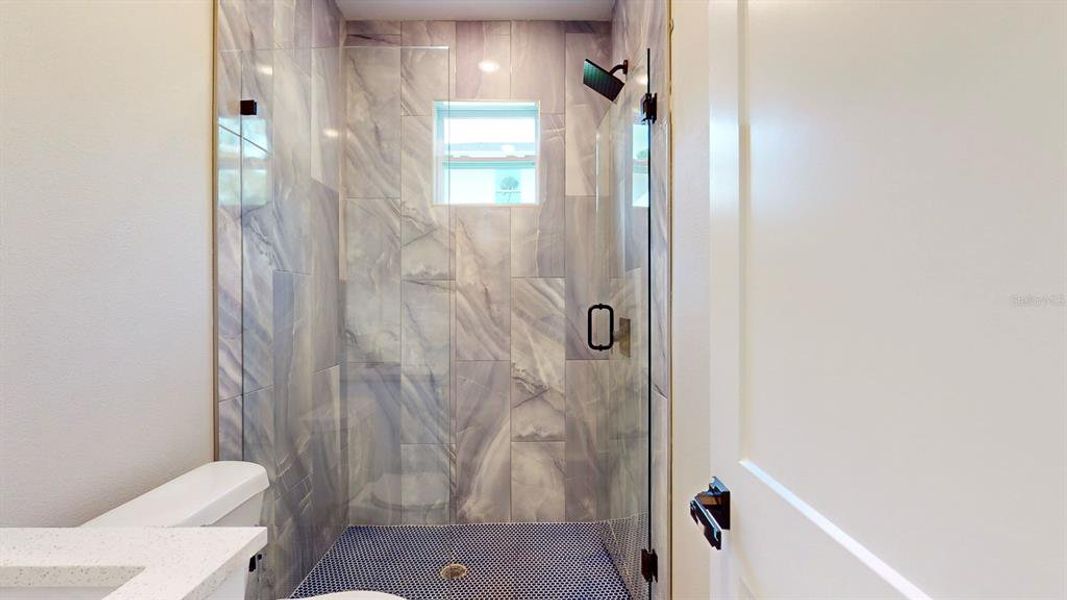 Tile is white in this home. This photo is of model while waiting on updated photography.