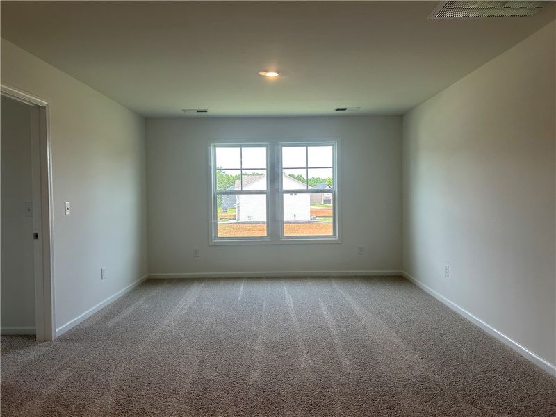 A quiet space awaits, with soft carpet underfoot a