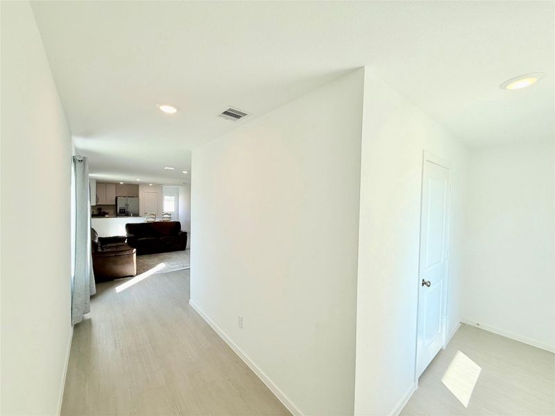 Private entryway to the home, offering a welcoming and secluded space for added privacy. To the right your'll find the laundry area and the garage door. Private entryway to the home, offering a welcoming and secluded space for added privacy. To the right your'll find the laundry area and the garage door.