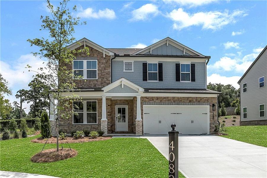 Front exterior of a new home in The Paddocks at Doc Hughes, Buford, GA, highlighting curb appeal (Image 2). Front exterior of a new home in The Paddocks at Doc Hughes, Buford, GA, highlighting curb appeal (Image 2).