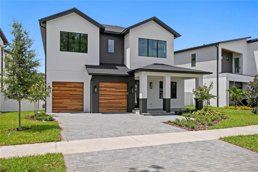Front exterior of a new home in , Tampa, FL, highlighting curb appeal (Image 27).